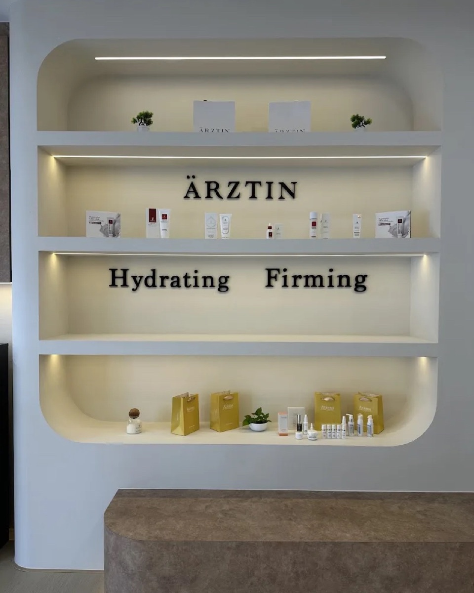 Backlit Ärztin display shelf at KIMHEI with Hydrating and Firming lettering