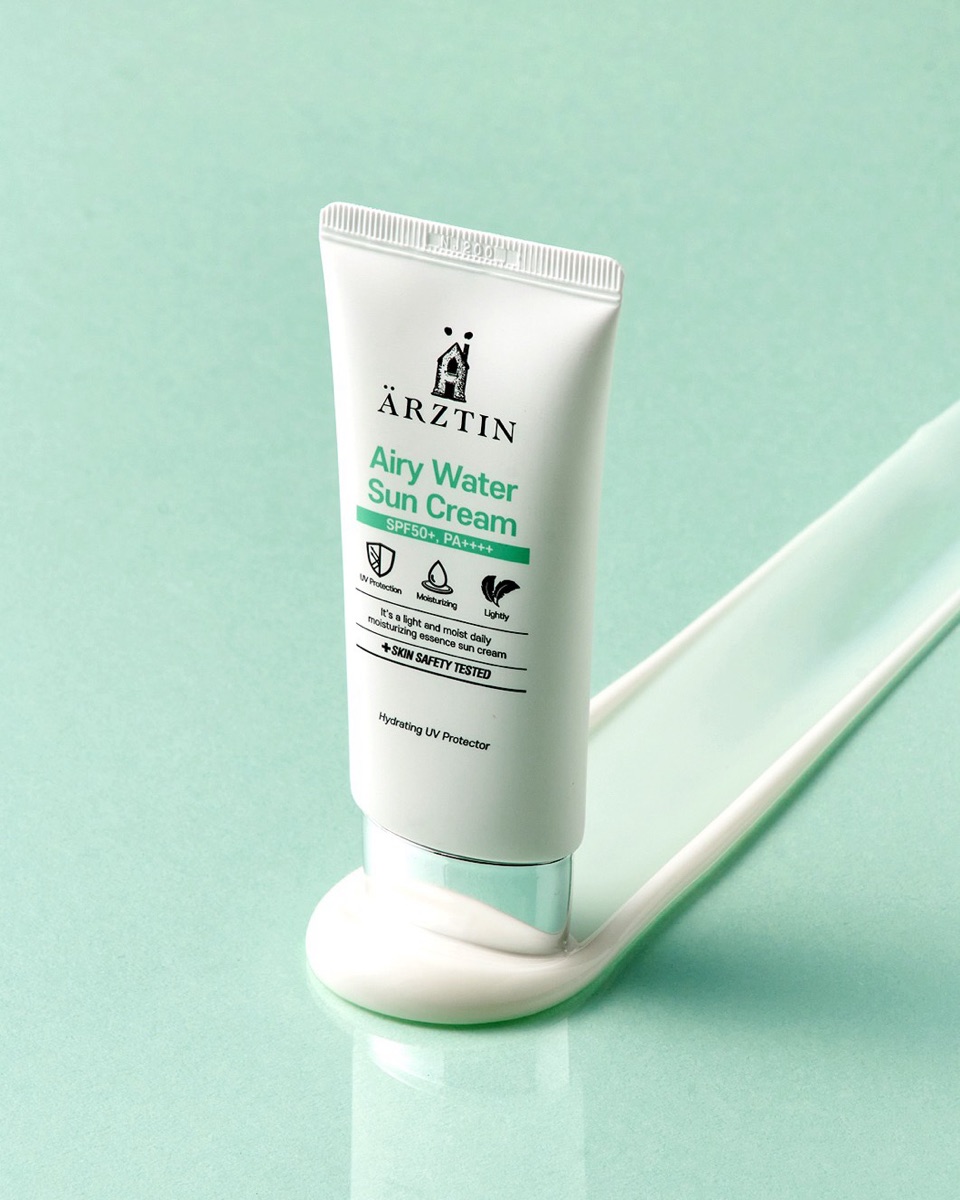 Ärztin Airy Water Sun Cream SPF50+ tube on mint green